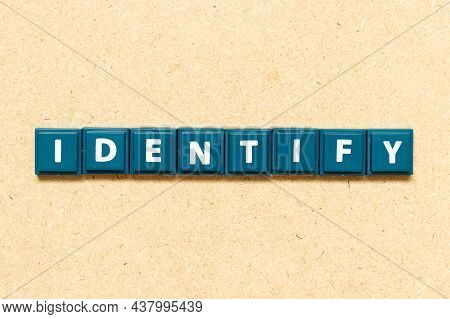 Tile Alphabet Letter In Word Identify On Wood Background