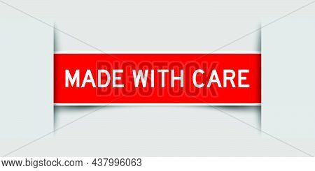 Inserted Red Color Label Sticker With Word Made With Cae On Gray Background