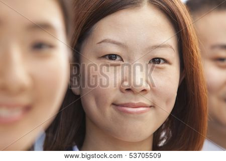 Young businesspeople in row