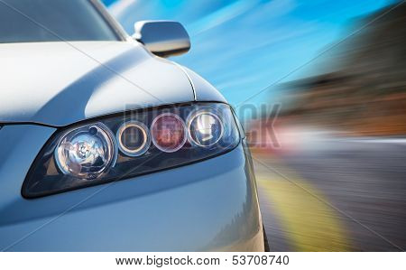 Rear Side View Of A Sport Car In Blurred Motion