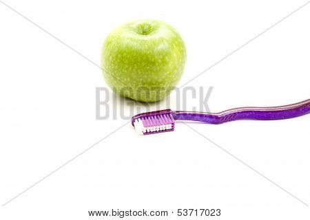 Toothbrush with Green Apple on white background