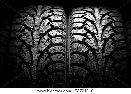  winter car tyre on a black background