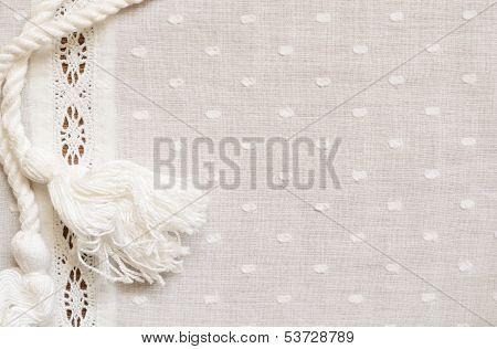 Spotted Fabric With A Strip Of Lace And A Rope