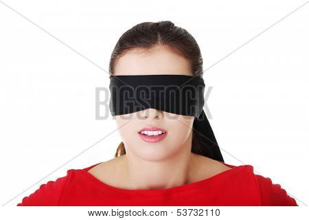 Attractive cheerful girl with band on eyes. Isolated on white. 
