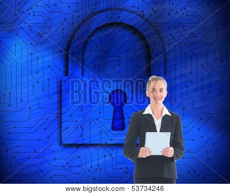 Composite image of blonde businesswoman holding new tablet