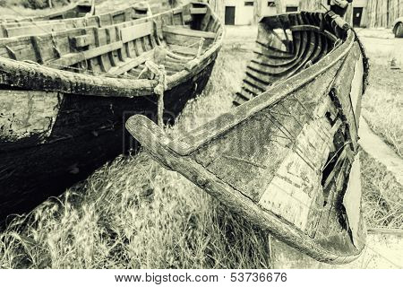 Old fishing boats stranded on the Jurilovca shore, near Danube Delta