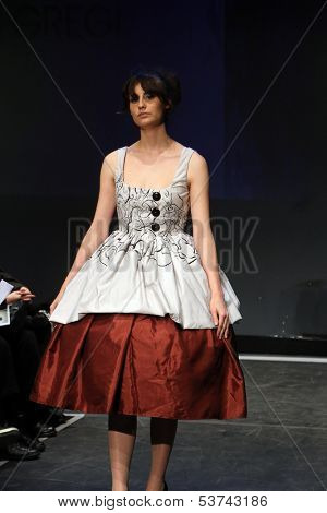 ZAGREB, CROATIA - NOVEMBER 07: Fashion model wearing clothes designed by Mitak and Gregl on the Fashion Wardrobe show on November 07, 2013 in Zagreb, Croatia.