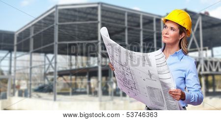 Professional Woman architect over Construction industry background.