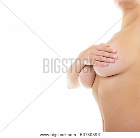 Body of beautiful woman covering her breast and showing armpit, over white