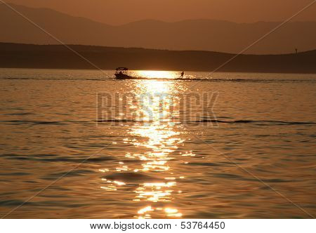 Water skier in sunset
