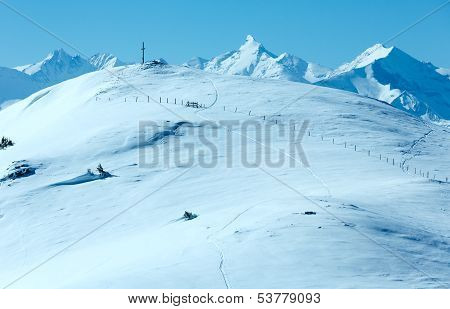 Cross On Winter Mountain Top