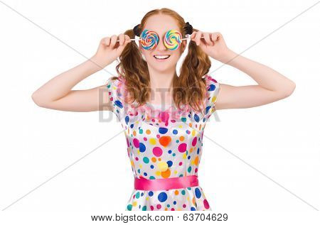 Redhead young girl with lolipops isolated on white