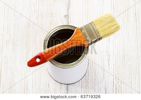 Paint Brush And Varnish Can, Paintbrush And Transpicuous Lacquer, White Color Container On Wooden Fl