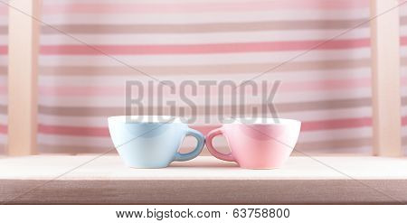 couple cups of soft background symbol for men and women