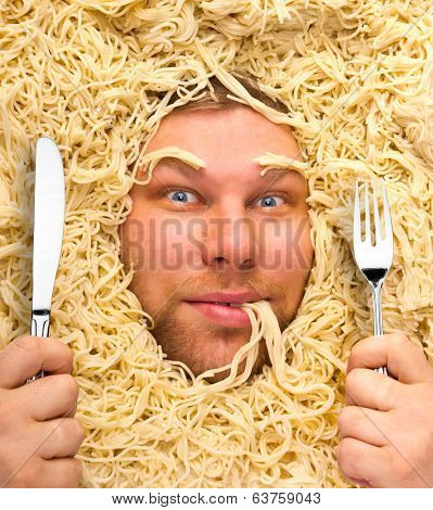Man's face in pasta, closeup