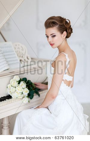 Portrait of beautiful woman in white dress