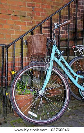 Blue bicycle with basket.