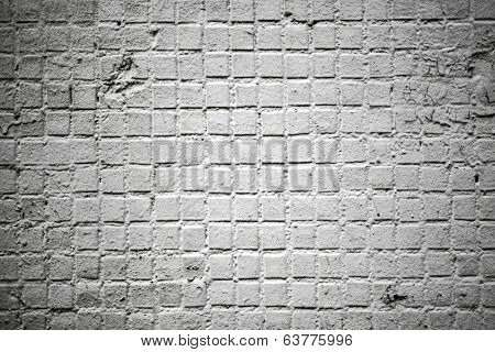 Abstract stonework background texture with old weathered dark stucco black paint stone cement wall in rural room Grungy cold rock surface in hard grime empty place with niello granite dull light floor