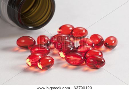 Red Capsules Near The Box