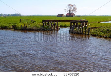 Dutch countryside with waterway and gateway