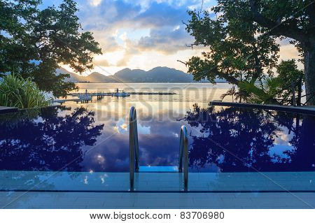 Pool At Tropical Beach At Sunset