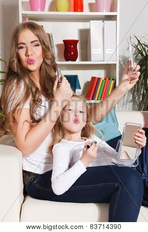 Happy Mother And Daughter At Home