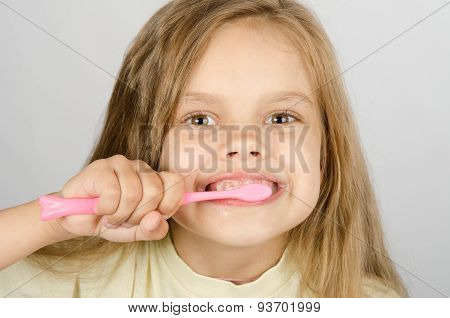 Six Year Old Girl Brushing Her Teeth