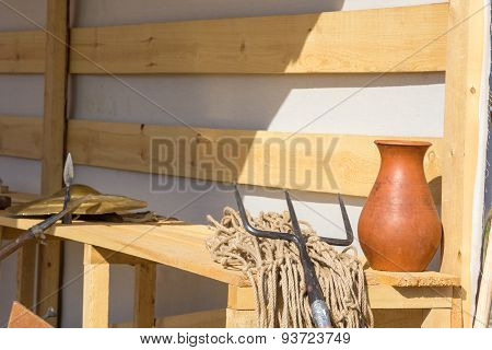 Gladiatorial Net And Trident On Wooden Bench