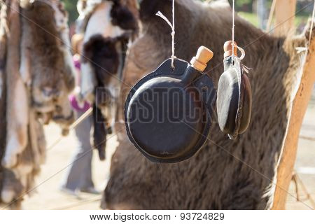 Leather Flask Hanging On Background Of Animal Skin