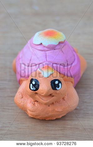 Turtle doll cartoon background wood