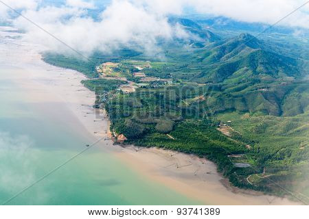 Beautiful, Hilly Countryside Along A Shallow Coastline, From The Air
