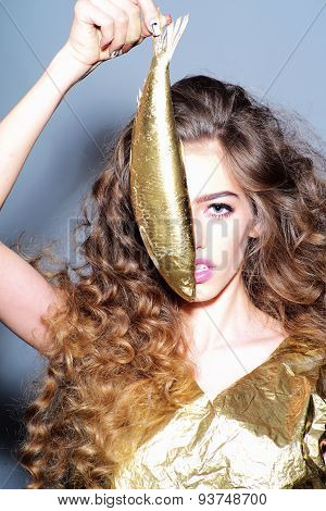 Winning Young Girl With Golden Fish