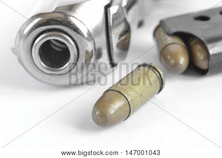 Pistol and ammunition on the white background.