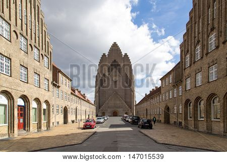 Copenhagen, Denmark - April 11, 2016: View of a road with Grundtvigs Church at the end
