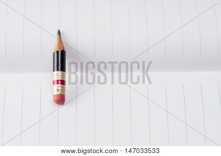 Black Pencil With Pink Eraser On A Paper