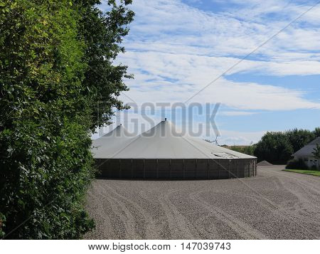 Two circular covered Slurry Tanks at farm in Southern Denmark