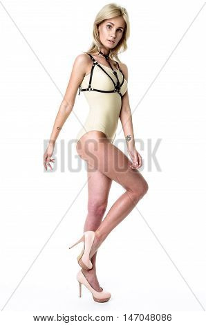 Blonde girl wearing bodysuit and black leather belt