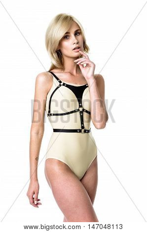Blonde girl wearing bodysuit and black leather belt