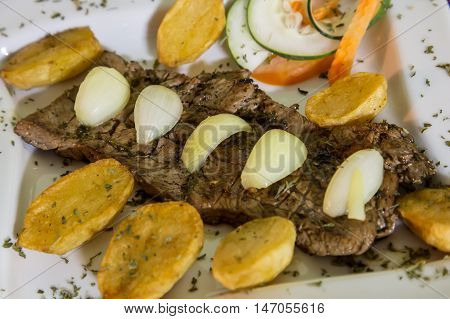 beef steak cooked with onion and platan