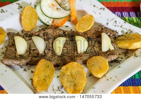 beef steak cooked with onion and platan