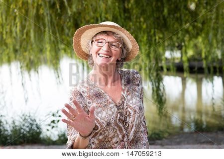 Elder happy woman outside in the nature