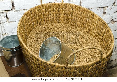 Wicker basket full of Eincorn wheat in a small bakery in a Bulgarian village