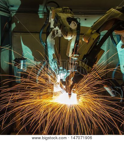 Welding robots movement in a car factory