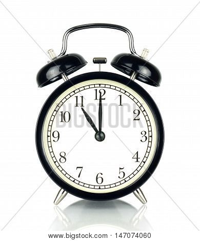 Alarm Clock isolated on white in black and white showing eleven o'clock.