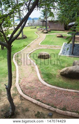 walkpath in natural resort with green plant