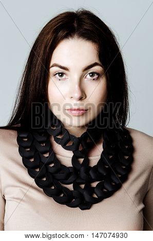 Brunette girl wearing dress and black leather belt