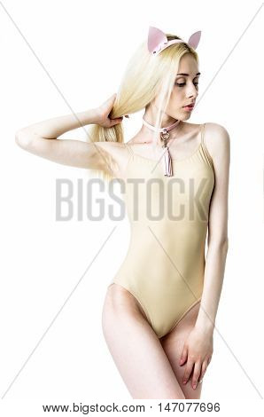 Blonde girl wearing bodysuit and leather chocker and ears
