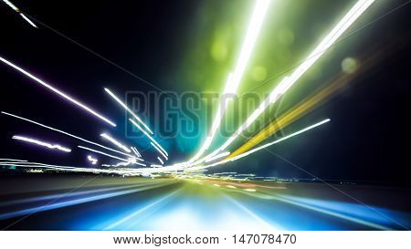 Blurred Abstract image of Long exposure night traffic light in the city