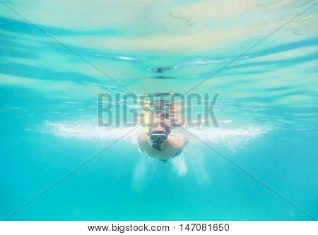 Skin diving or snokerling at shallow of beach