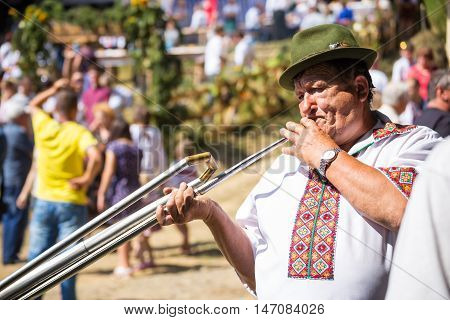 4 September 2016. Rakhiv Transcarpathian region Ukraine. Celebration - Festival Hutsul brynza . Colorful procession - parade of people dressed in national costumes. Follk musician